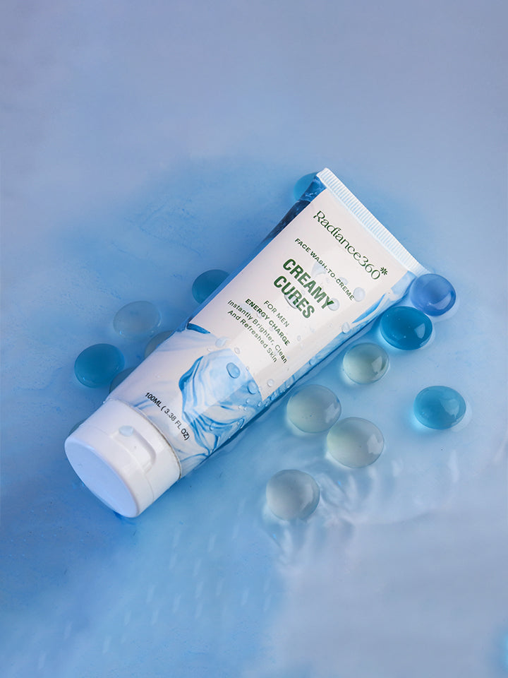 Tube of Radiance 24K Creamy Cures on a blue background with blue beads